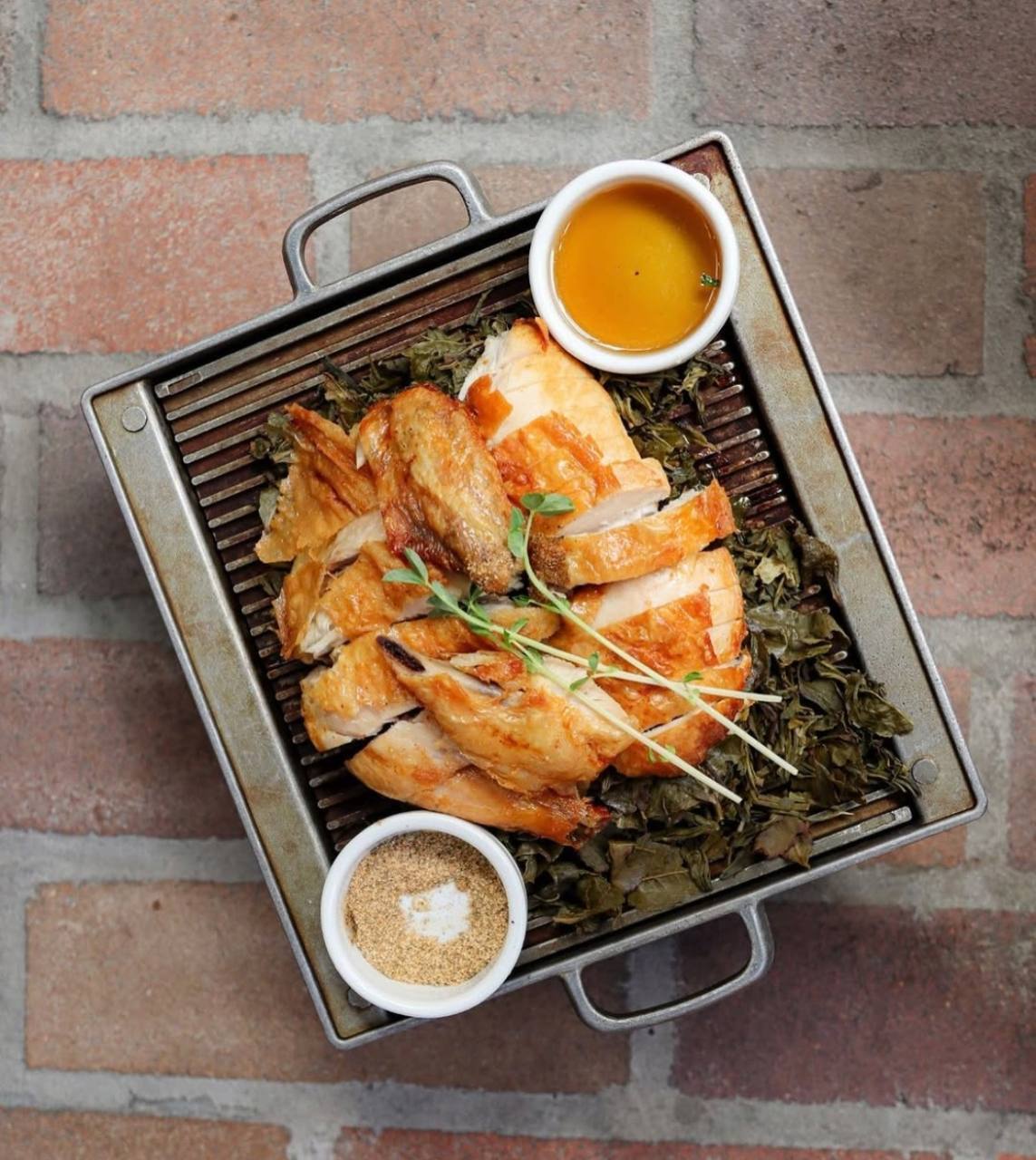 Golden roast chicken with dipping sauces at LÜCHA in Brisbane CBD
